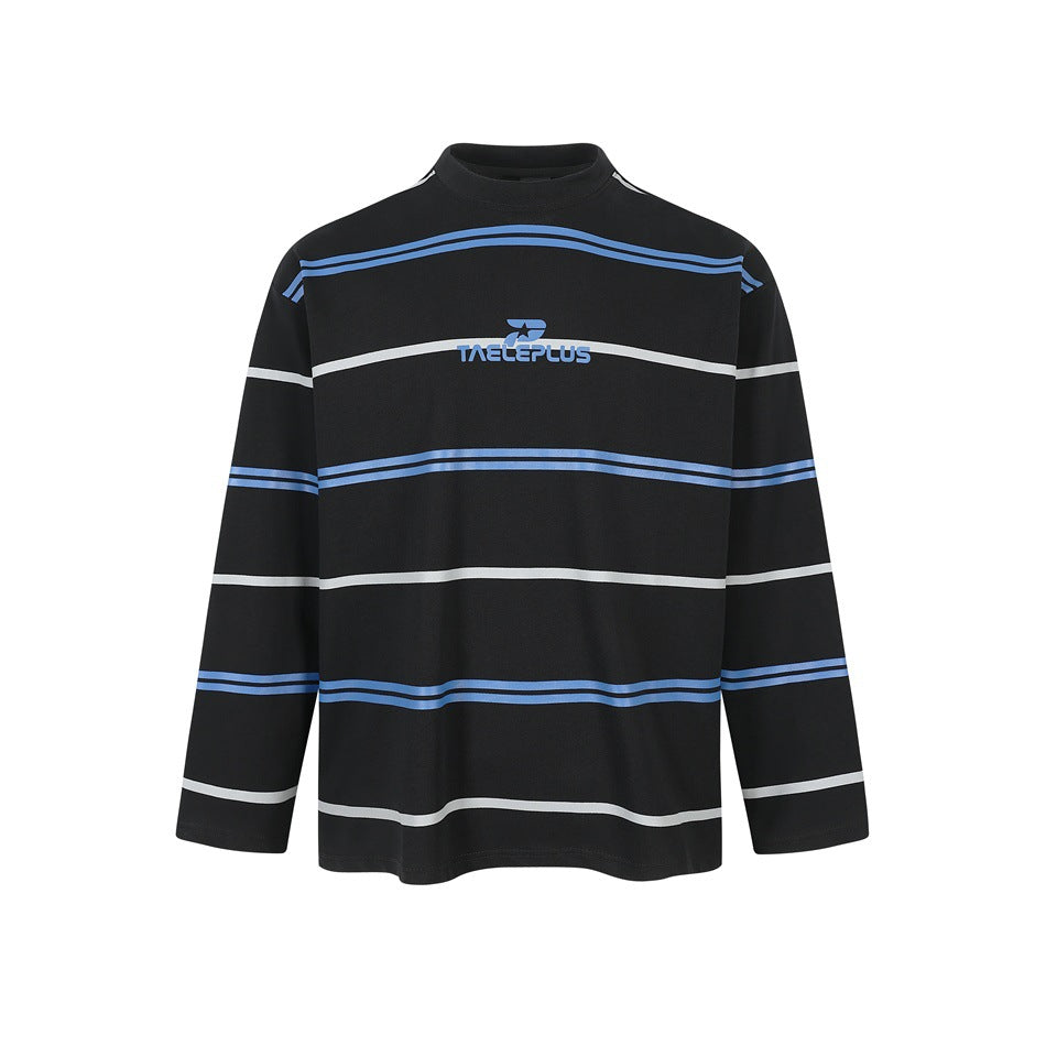 Black long-sleeve striped top with blue and light gray horizontal stripes and a small blue chest print, front view