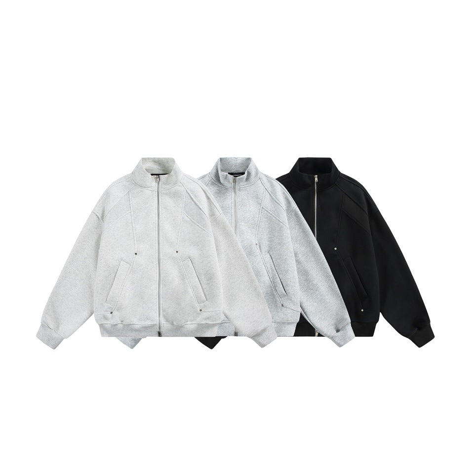 Three front views of a stand-collar zip-up jacket in light gray, pale gray, and black.