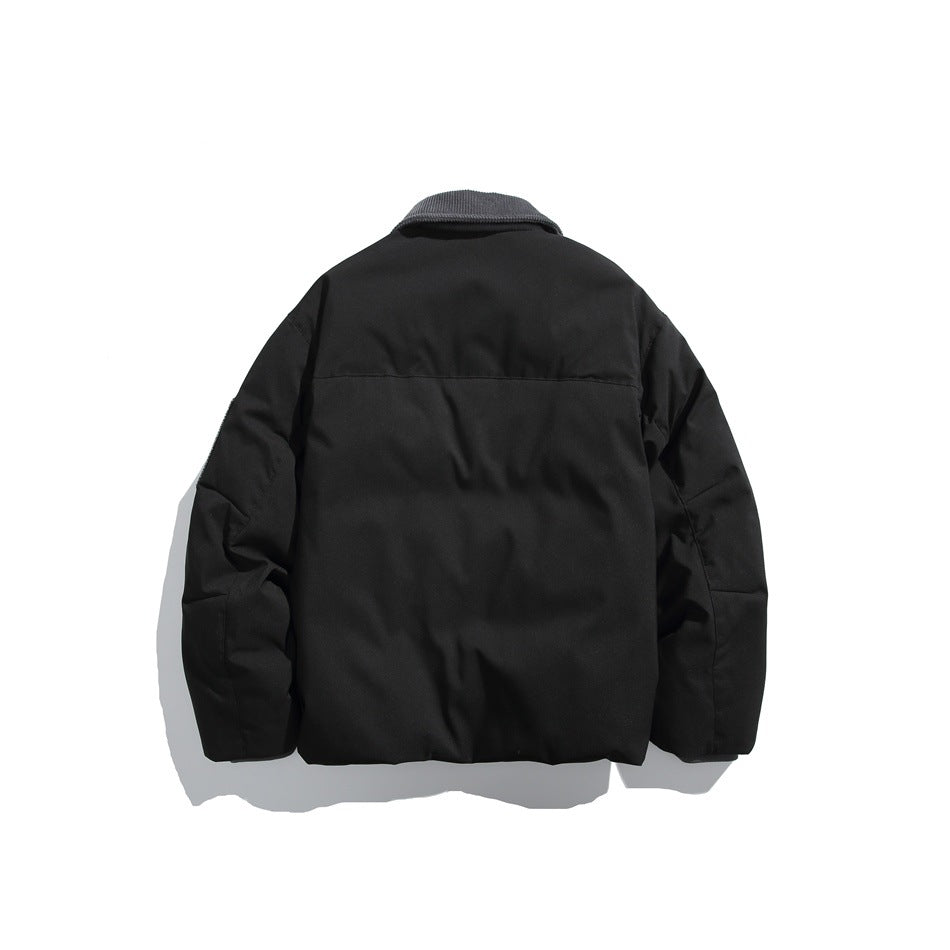 Back view of a black jacket with a dark gray collar, long sleeves, and a horizontal upper-back seam.