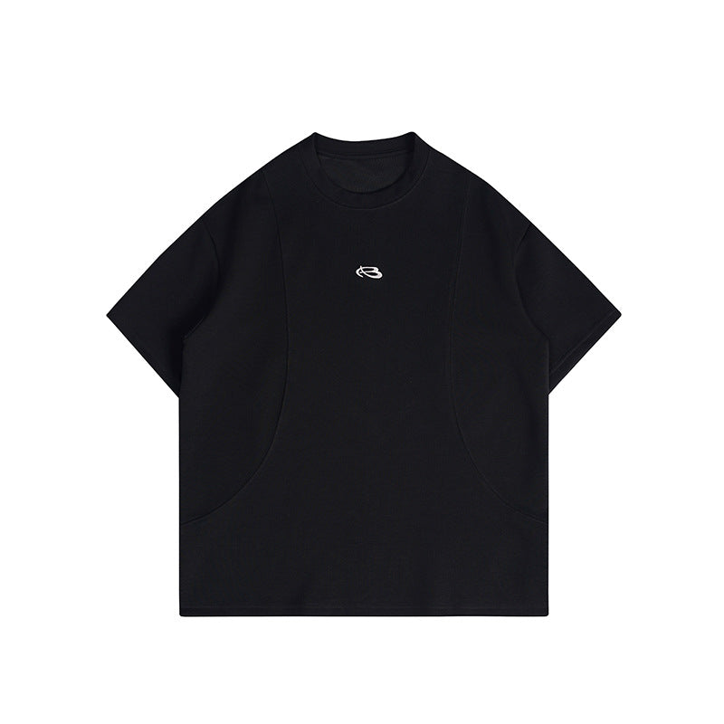 Black short-sleeve crew-neck T-shirt with curved panel seams and a small white embroidered emblem at the chest
