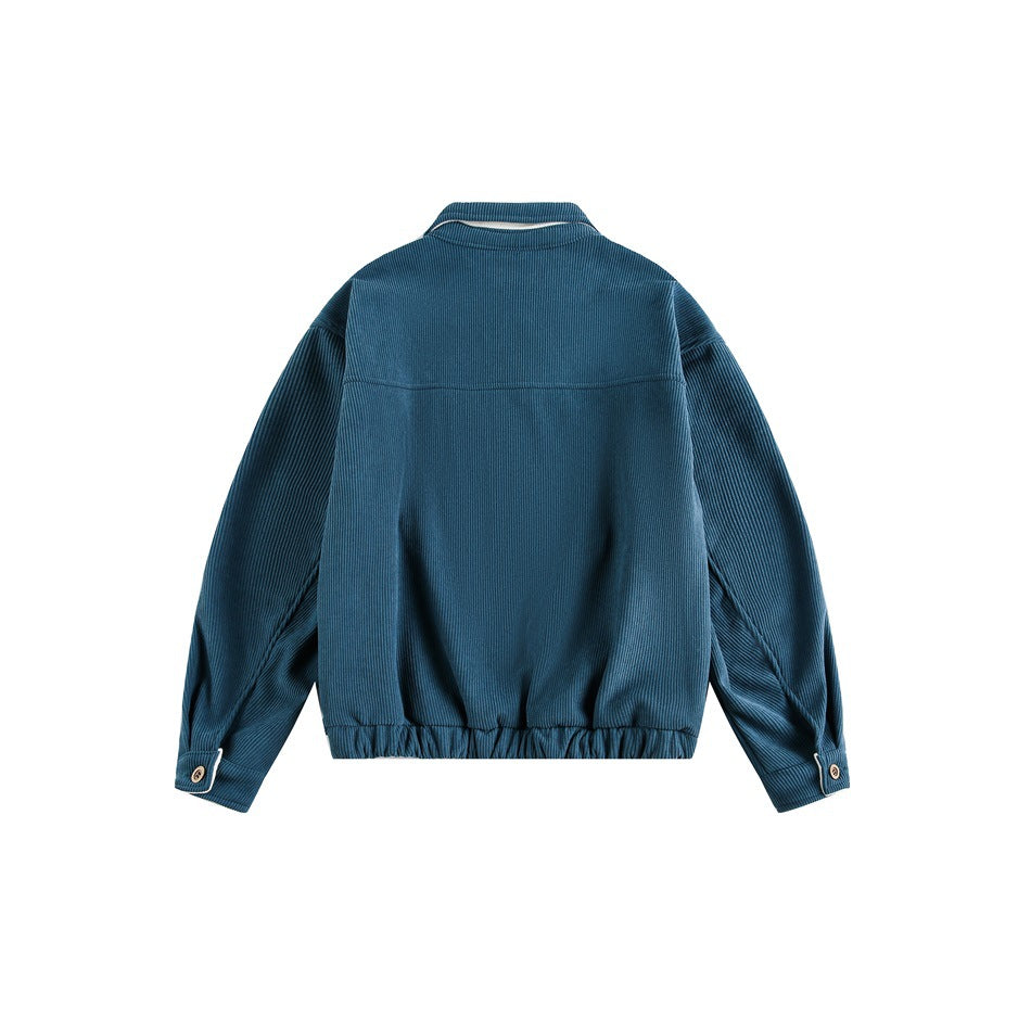 Back view of a blue jacket with a gathered hem, buttoned cuffs, and a narrow white accent at the collar.