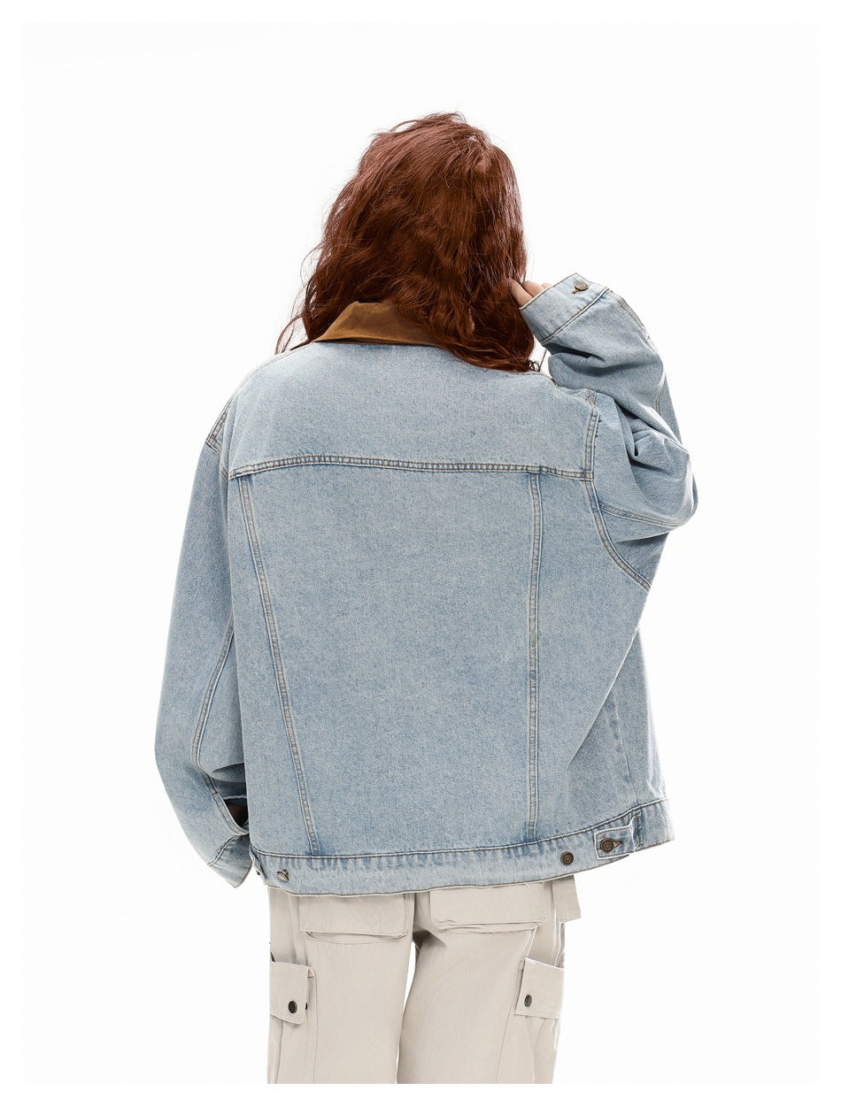 Back view of a person wearing a light blue denim jacket with a brown collar and cream cargo pants.