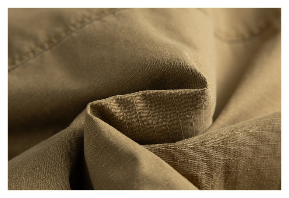 Close-up showing the olive-khaki fabric texture, folds, and stitching.