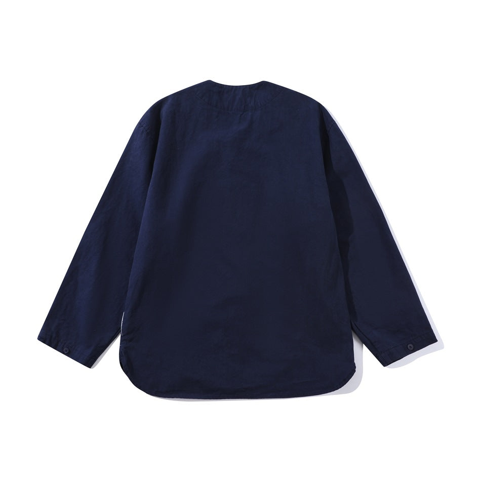 Back view of navy blue collarless long-sleeve jacket with plain back, curved hem and button at the cuff