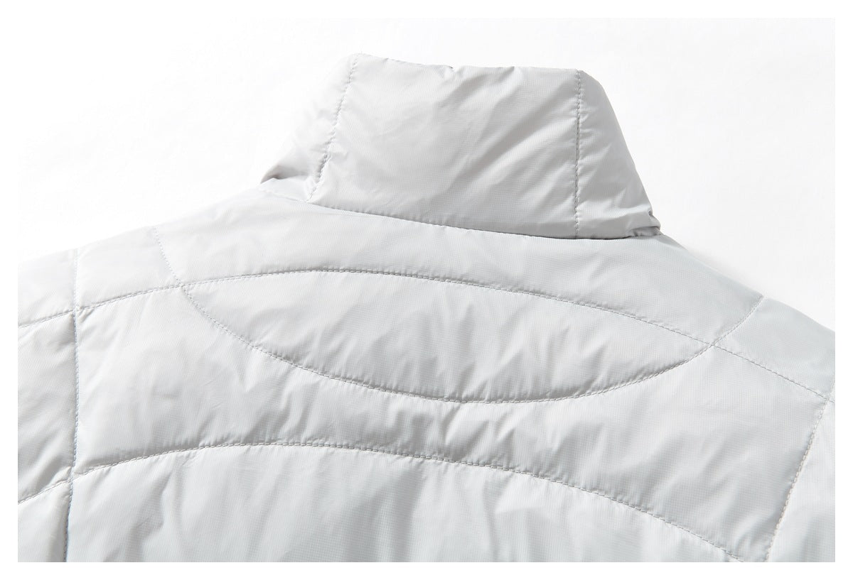 Upper back of a white quilted jacket with a raised collar and curved stitched panels.