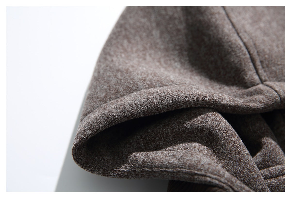 Close-up of the heathered gray-brown hood, showing its folded edge and stitched seam.