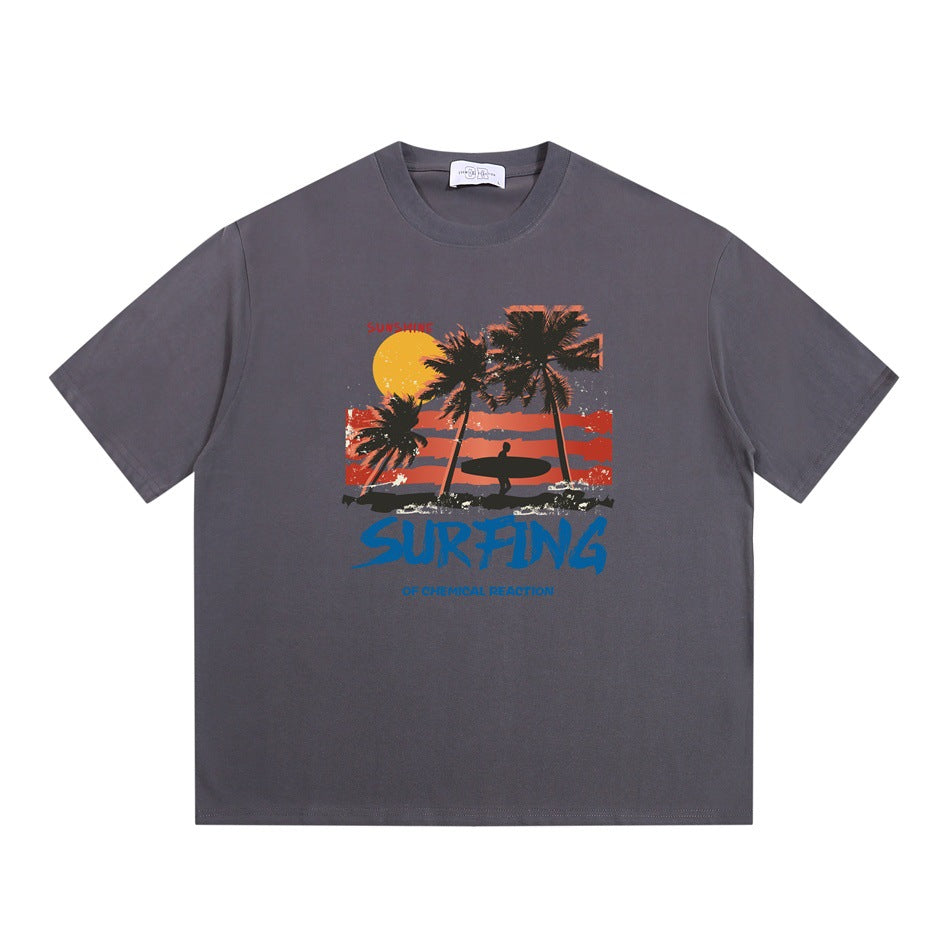 Gray short-sleeve crew-neck T-shirt with palm tree sunset surfer graphic and blue SURFING lettering