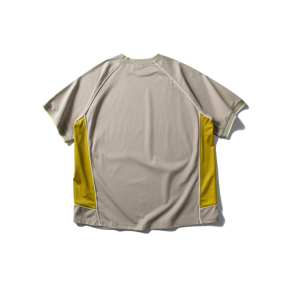 Back view of a taupe short-sleeve T-shirt with yellow side panels and white piping.
