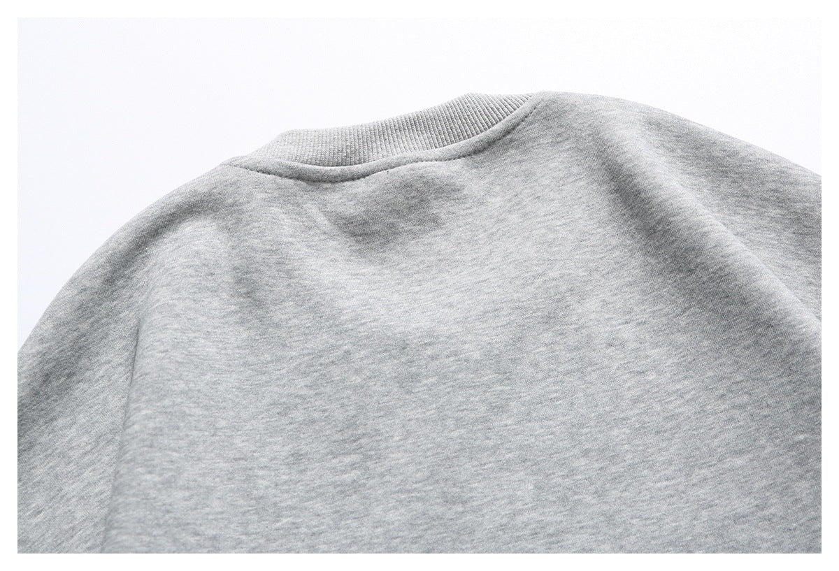 Back view of a heather gray sweatshirt laid flat, showing the ribbed crew neckline and plain back.