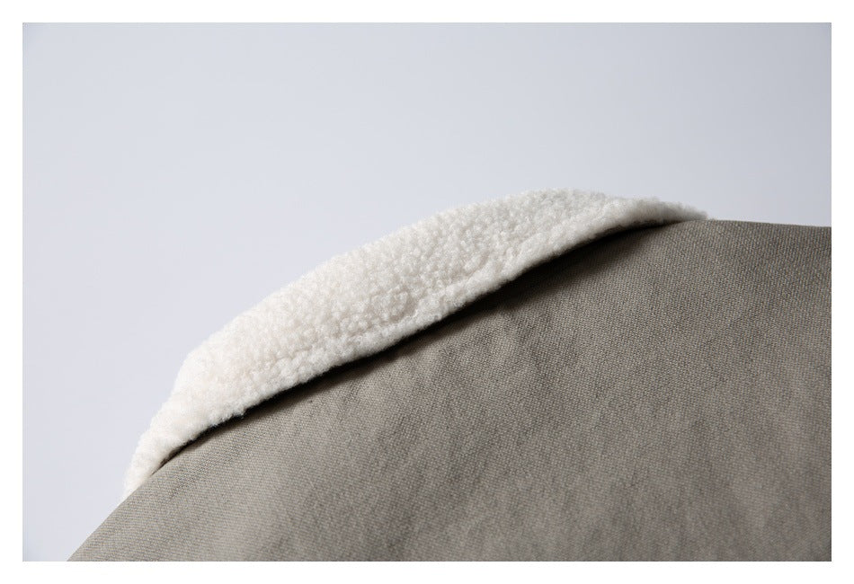 Close-up of the taupe jacket's collar with a thick white fleece lining.