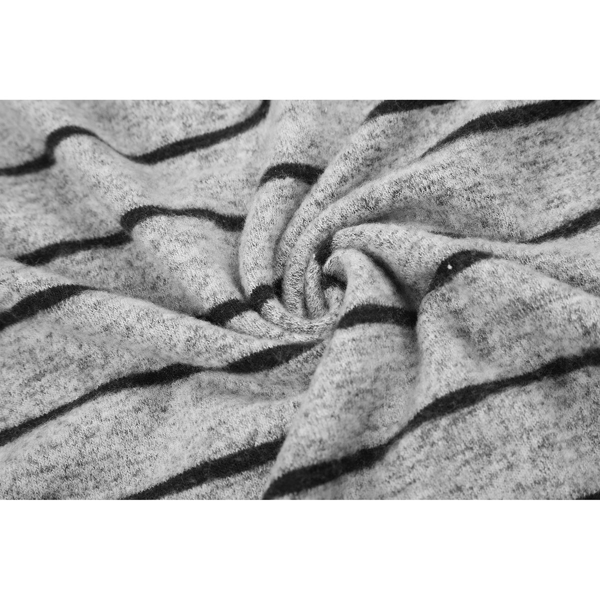 Close-up of the gray marl knit and black stripes gathered into folds.