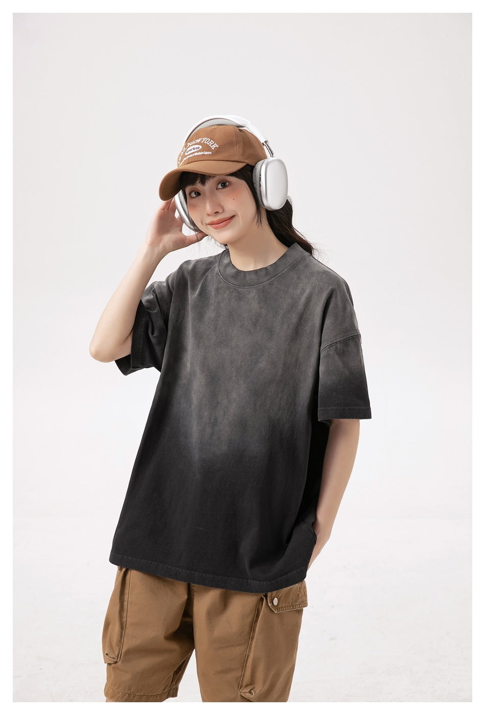 Model wearing a charcoal oversized short-sleeve T-shirt with a crew neck, shown from the front.