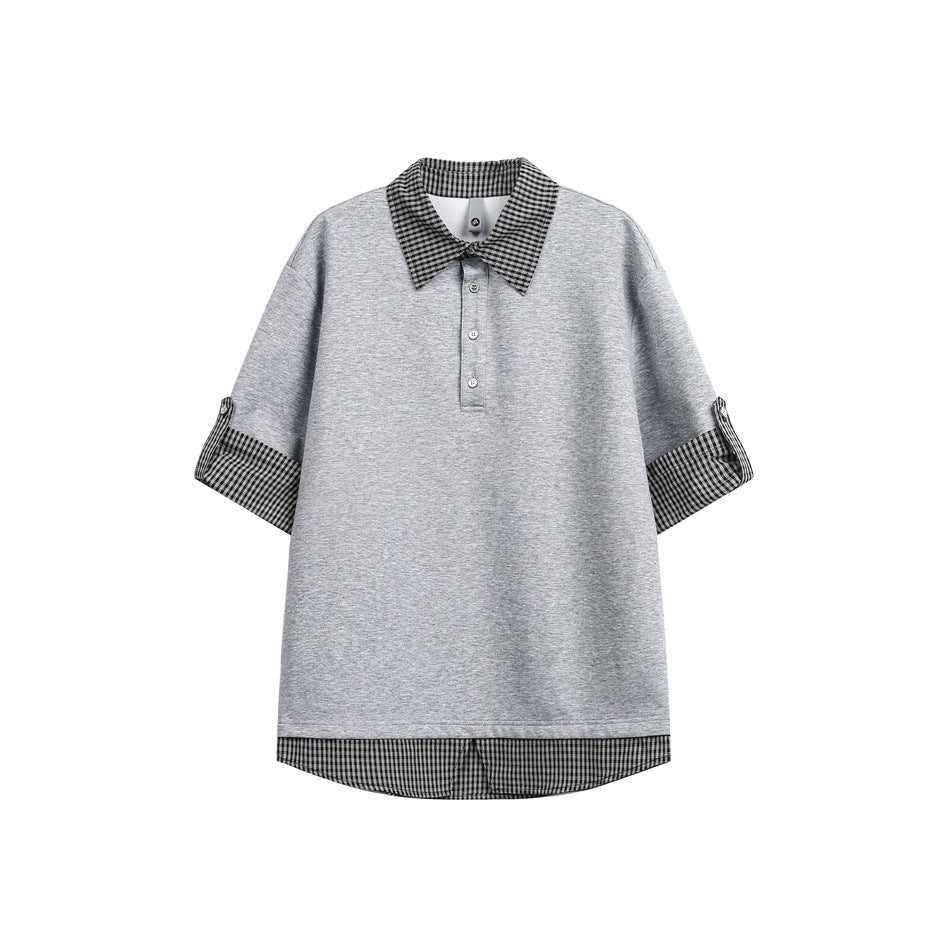 Gray short-sleeve polo-style top with gingham collar, button placket, rolled check sleeves and check hem layer