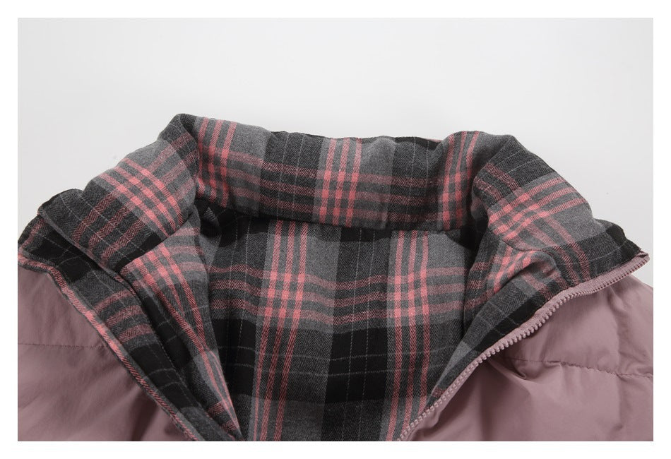 Open neckline of a dusty mauve jacket with charcoal plaid lining and pink stripes.