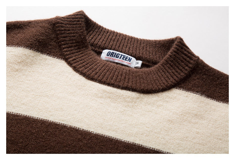 Close-up of the brown ribbed crew neckline and cream stripe on a brown-and-cream sweater, with a sewn-in label.