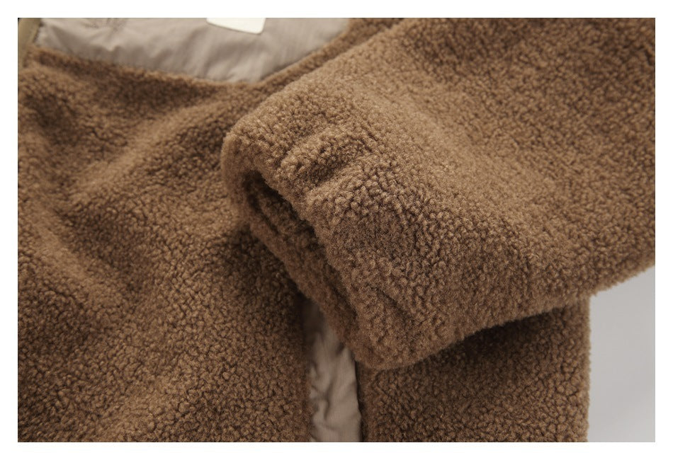 Close-up of a brown fleece sleeve and body, showing the thick textured fabric.