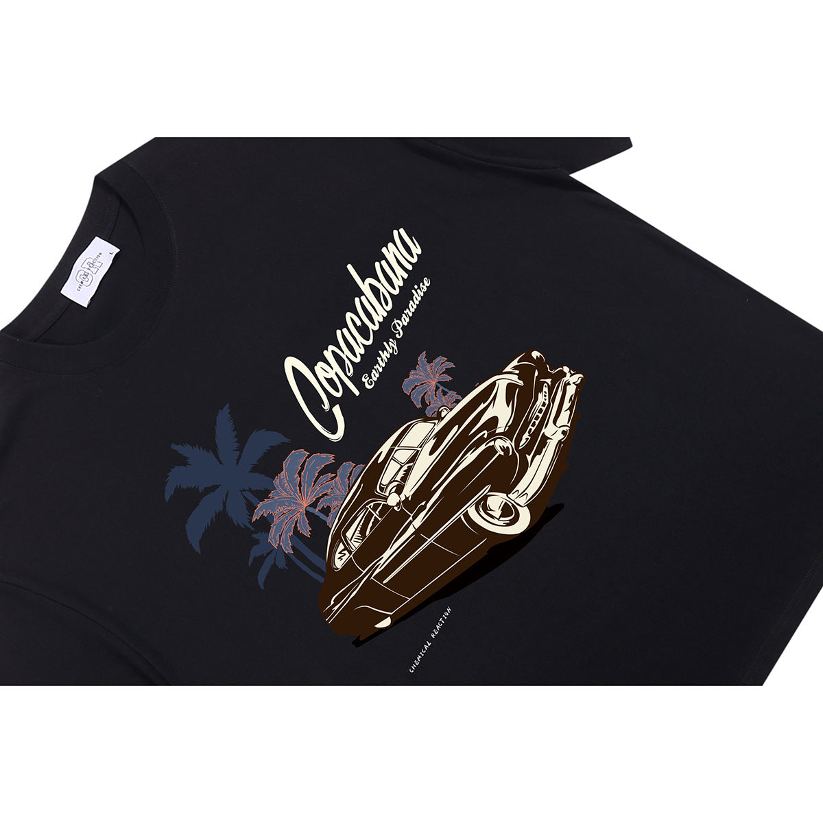 Angled flat lay of a black T-shirt with a cream classic-car and palm-tree graphic and script lettering.