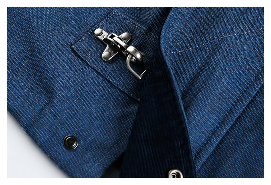 Close-up of dark blue fabric with a metal hook clasp and snap hardware.