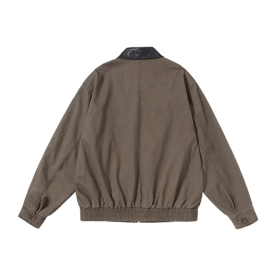 Khaki brown jacket back view with center seam, black collar, button cuffs and elastic hem