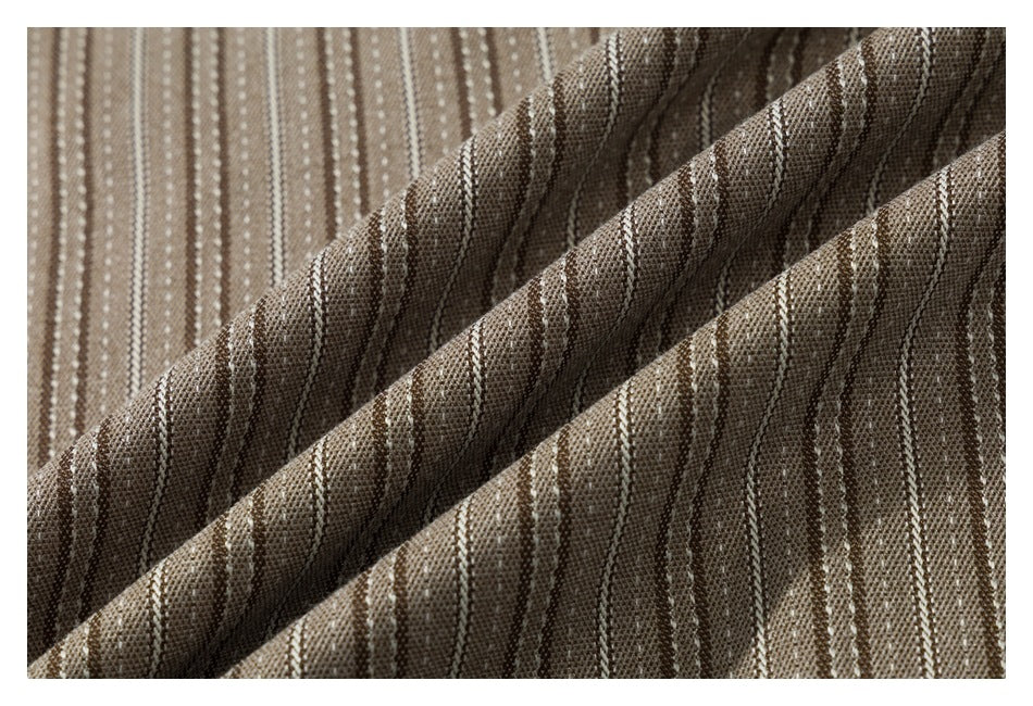 Close-up of brown shirt fabric with narrow cream stripes and a visible woven texture.