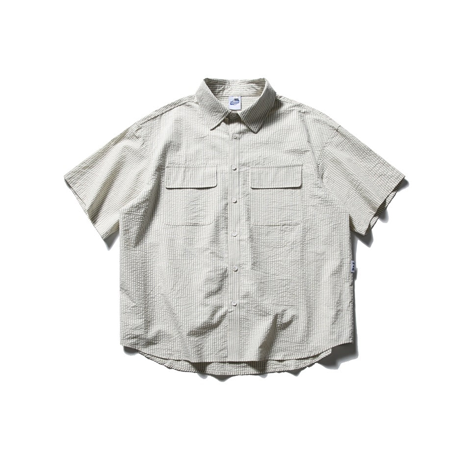 Light gray short-sleeve button-up shirt with fine dark stripes, a pointed collar, and two flap chest pockets.