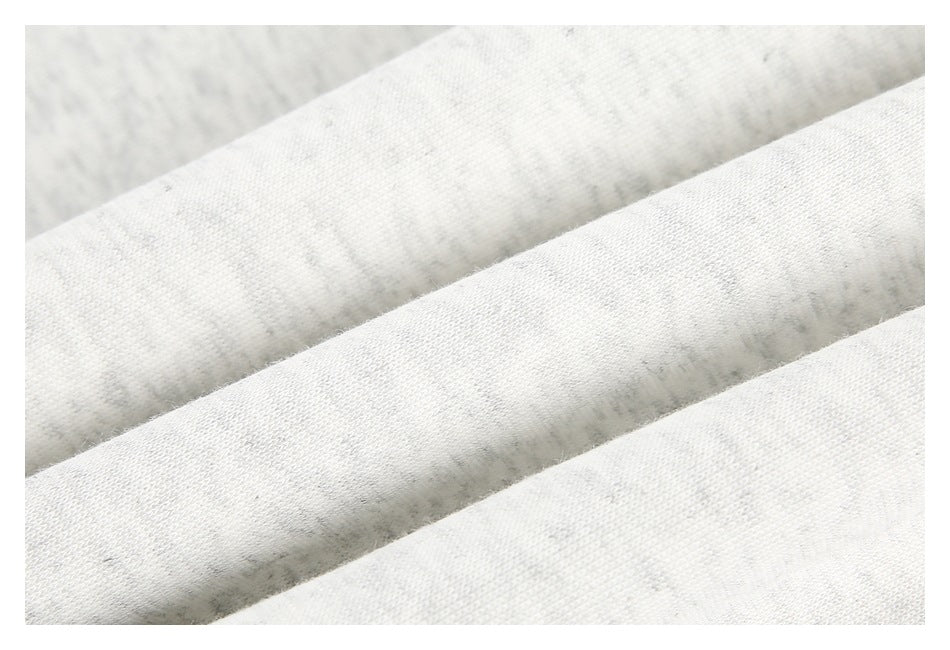Macro view of the light heather-gray fabric surface and knit texture.