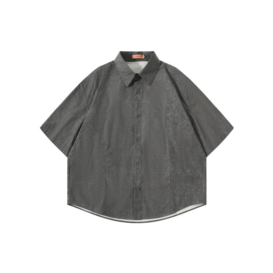 Dark gray short-sleeve button-up shirt with pointed collar and mottled texture, shown flat from the front