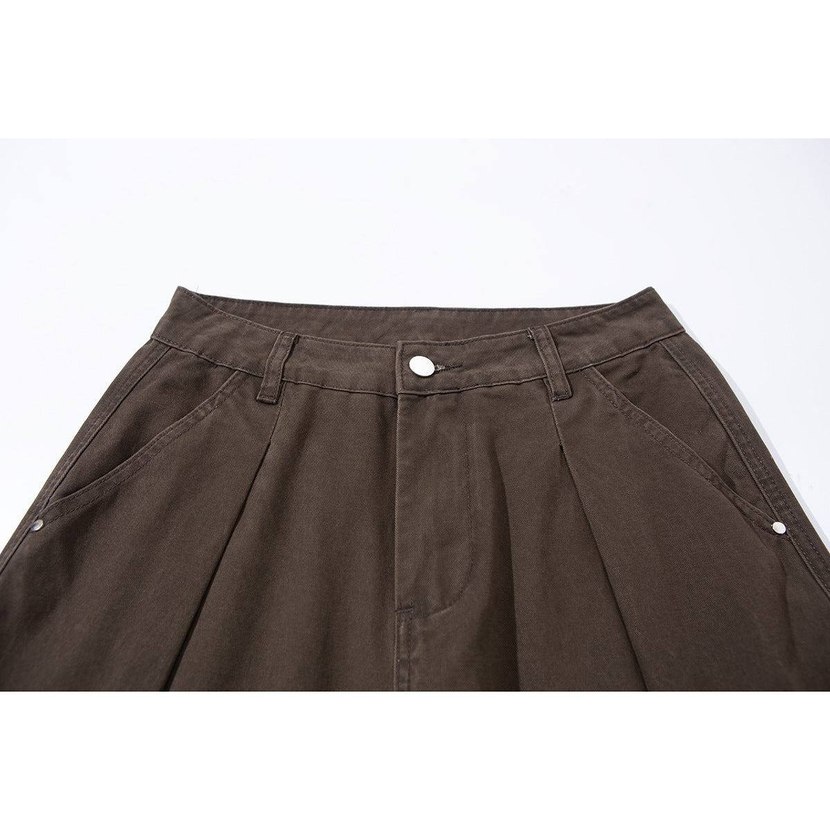 Close-up of dark brown wide-leg cargo pants showing the waistband, button, belt loops, pleats and angled pockets.