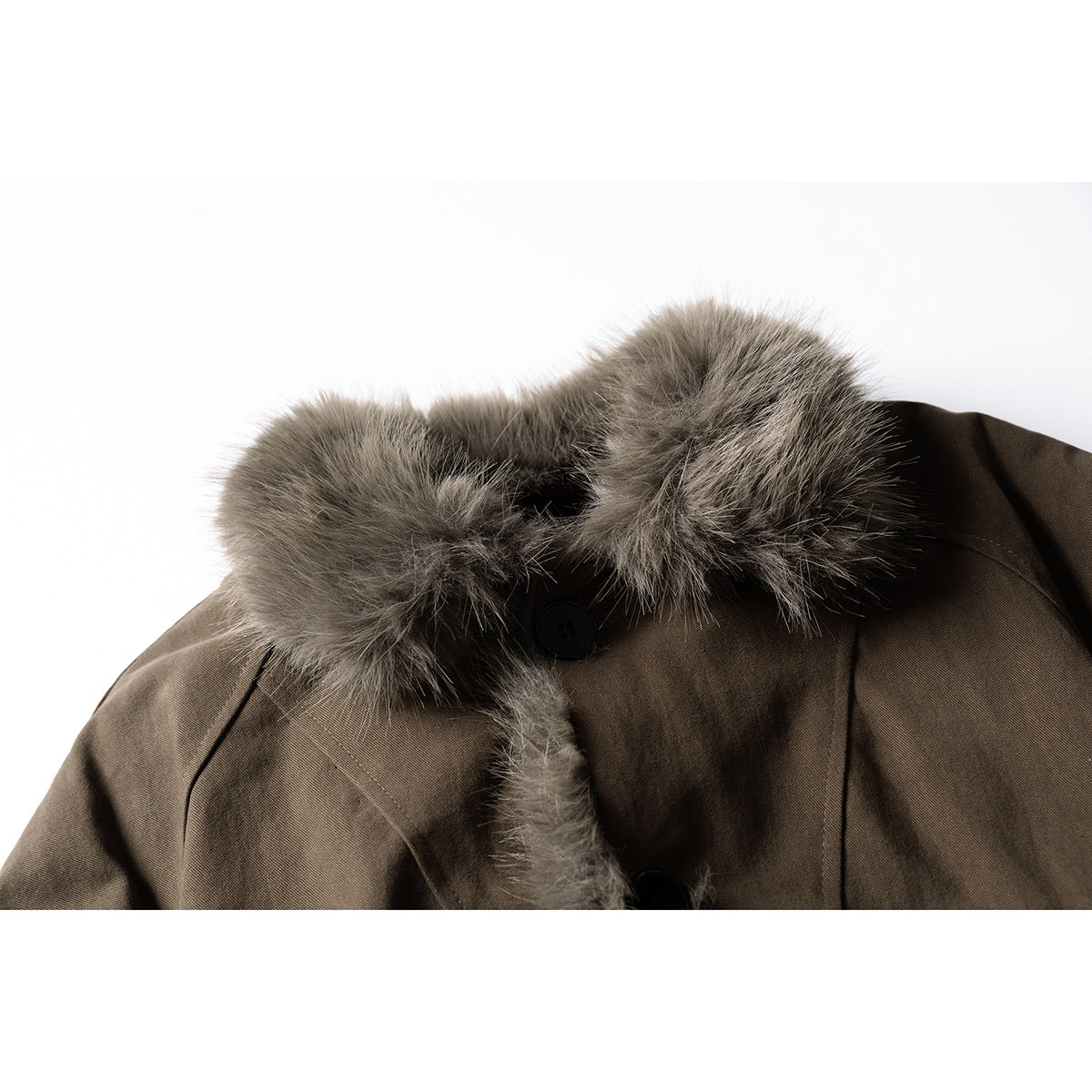 Close-up of a dark brown jacket collar with gray-brown fur trim and a black button.