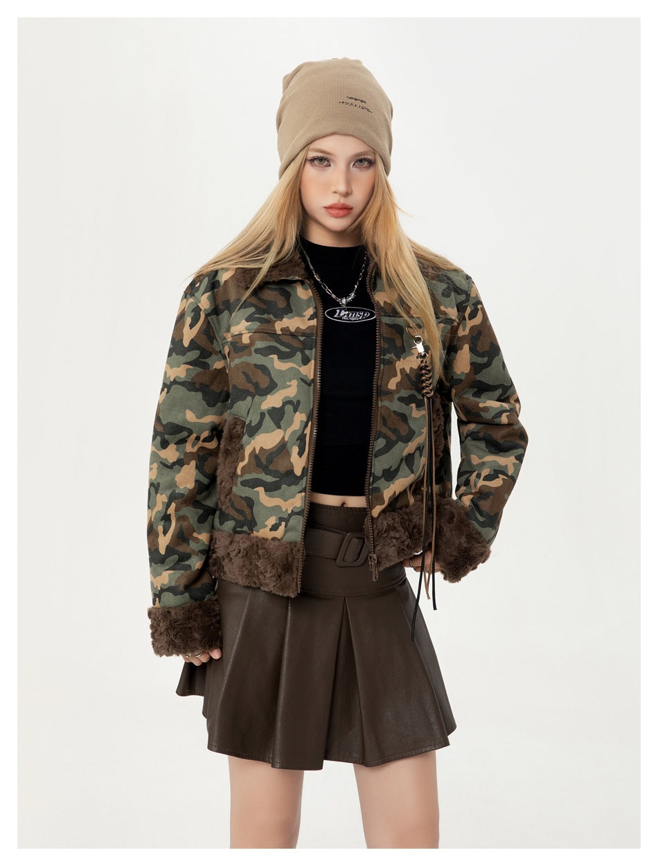 Front view of a model wearing a camouflage jacket with dark brown plush trim and a beige beanie.