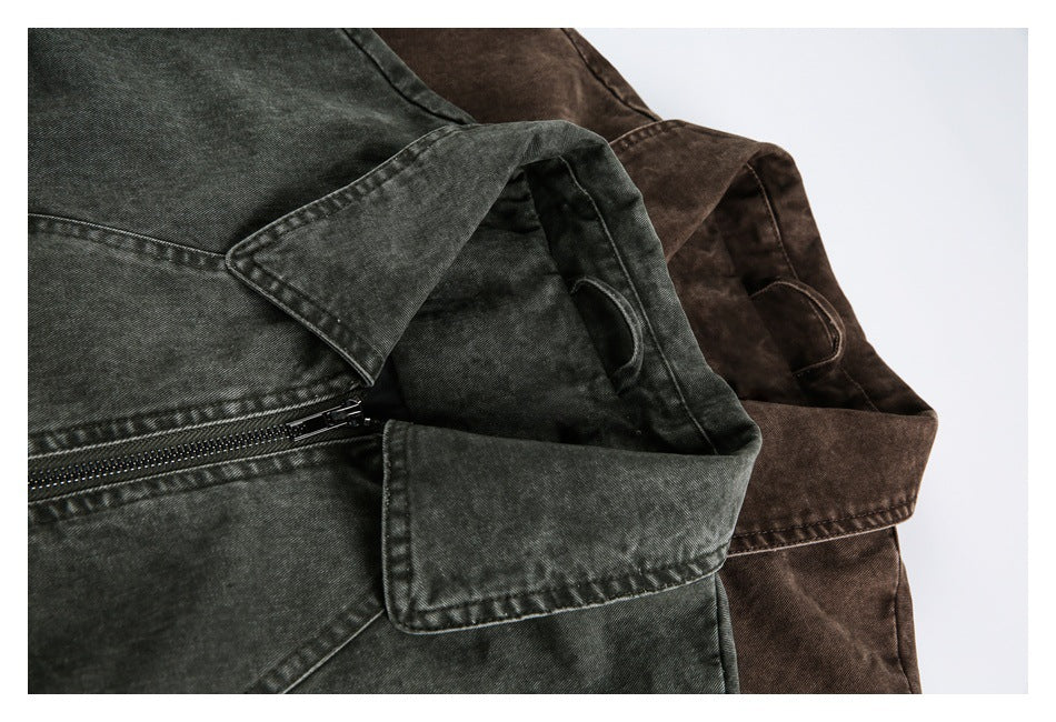 Close-up of charcoal and brown washed jackets showing collars and front zipper details.