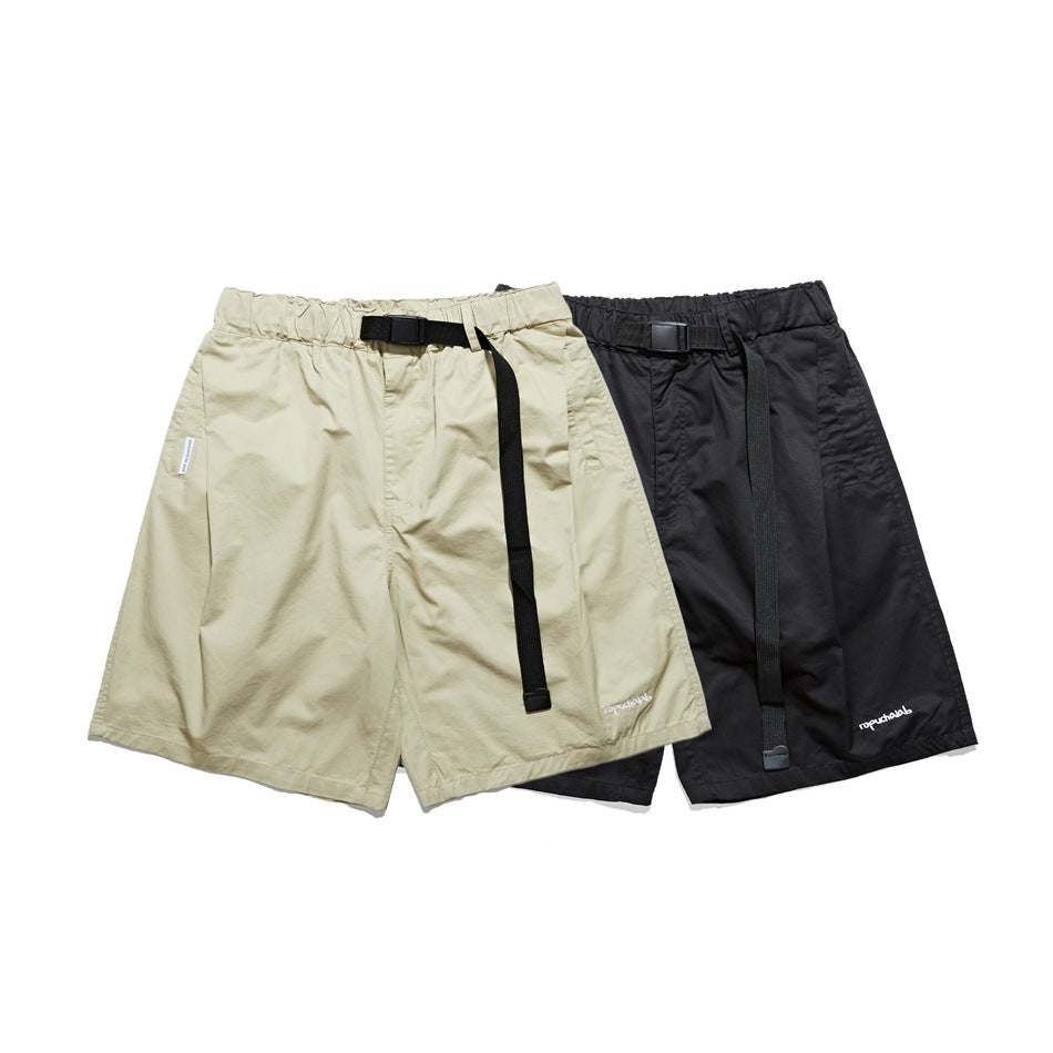Beige and black shorts shown together from the front, each with an elastic waist and long black belt.