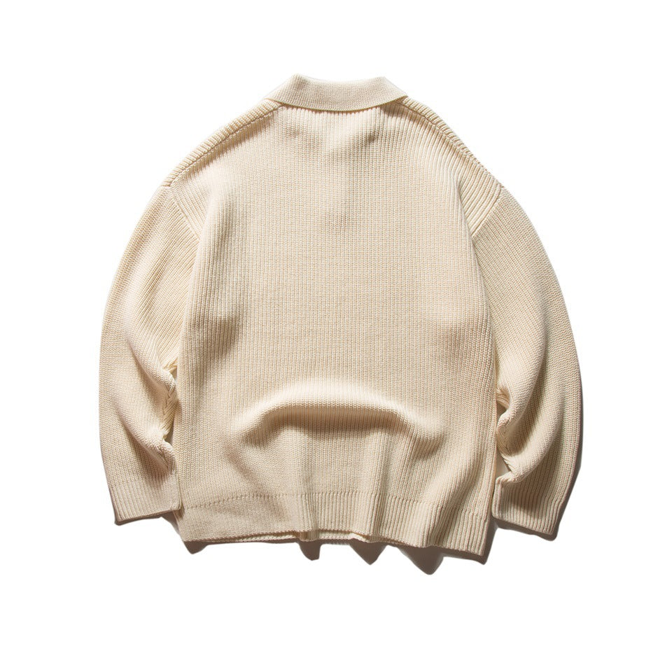 Back view of apricot ribbed knit polo-collar sweater with drop shoulders, flat lay