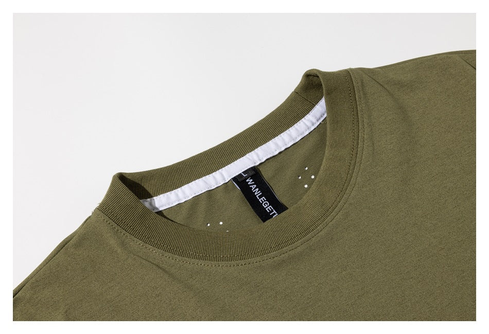 Close-up of an olive-green crew-neck shirt collar, white inner neck tape, and black size label.