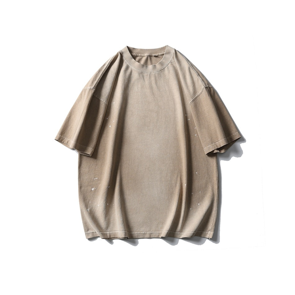 Khaki washed short-sleeve crew-neck T-shirt with light paint splatter, flat front view
