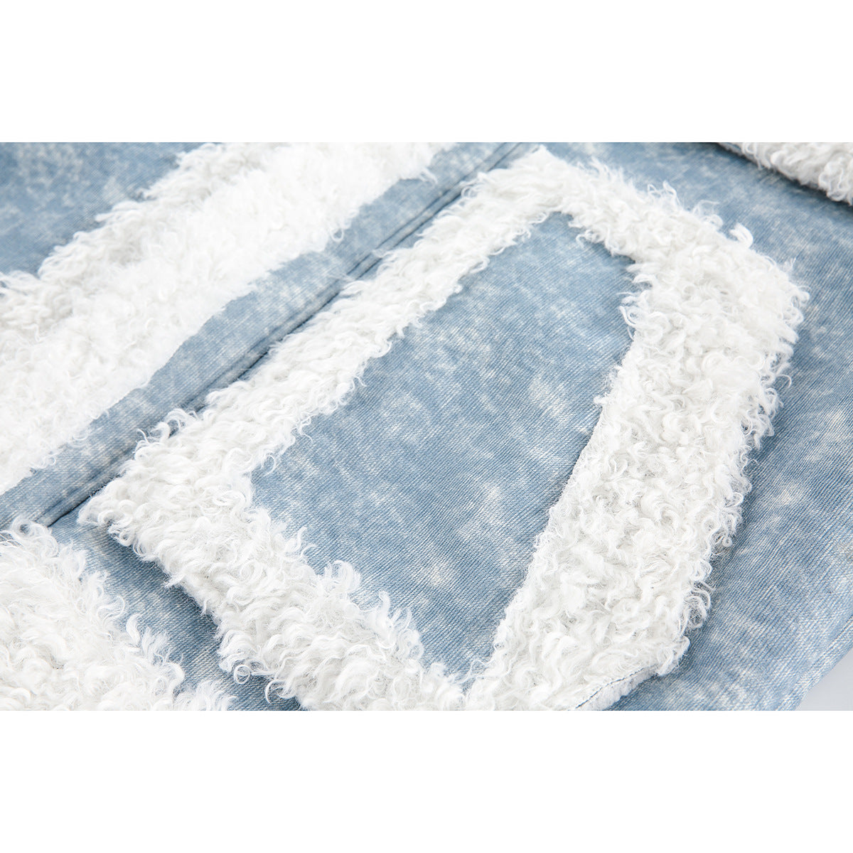 Close-up of the jacket's light blue fabric and thick white shaggy trim around a pocket.