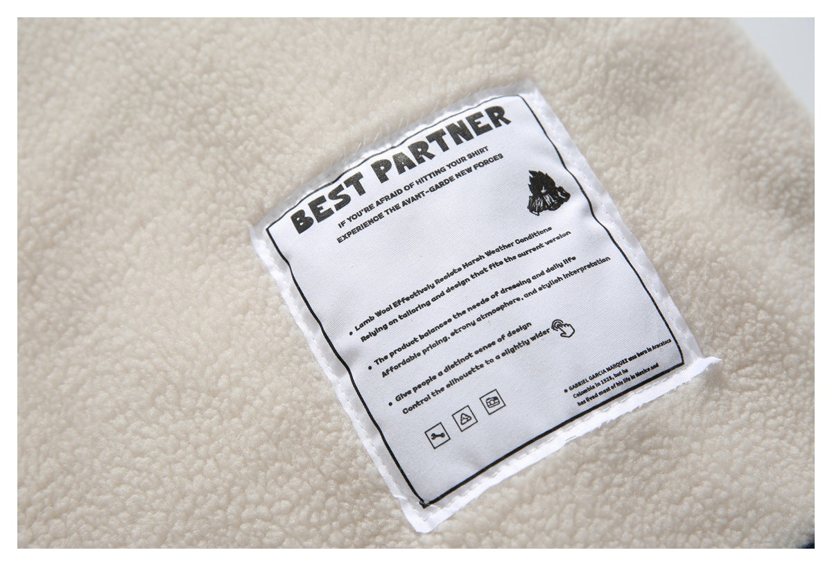 Close-up of a sewn BEST PARTNER label with English text on cream fleece.