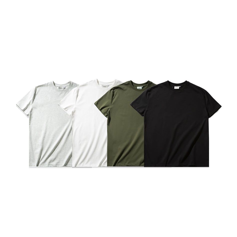 Four plain crew-neck T-shirts shown together in light gray, white, olive green, and black.