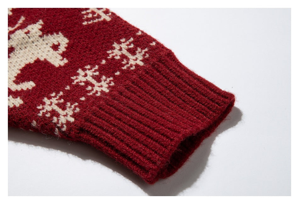 Deep red ribbed sleeve cuff with cream reindeer and snowflake knit motifs.
