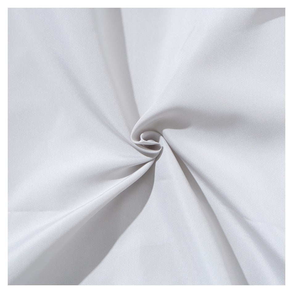 Close-up of smooth white fabric gathered into a twist, showing its surface and drape.