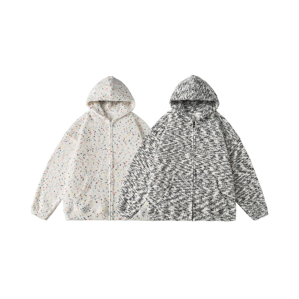 Two hooded zip-front jackets shown side by side: one white with colorful flecks and one black-and-white patterned.