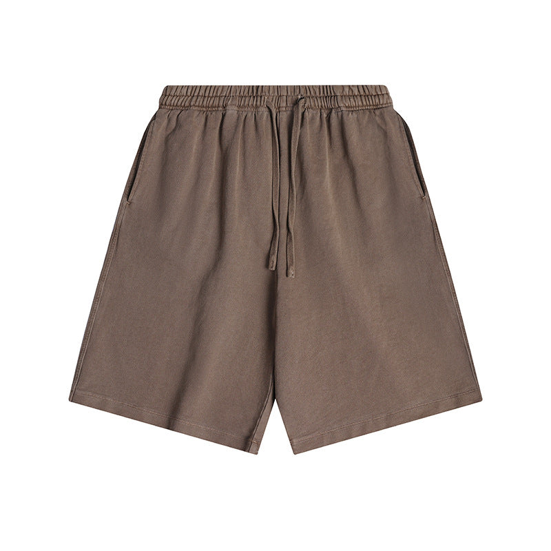 Brown washed-look knee-length drawstring shorts with elastic waistband and side pockets, flat lay front view
