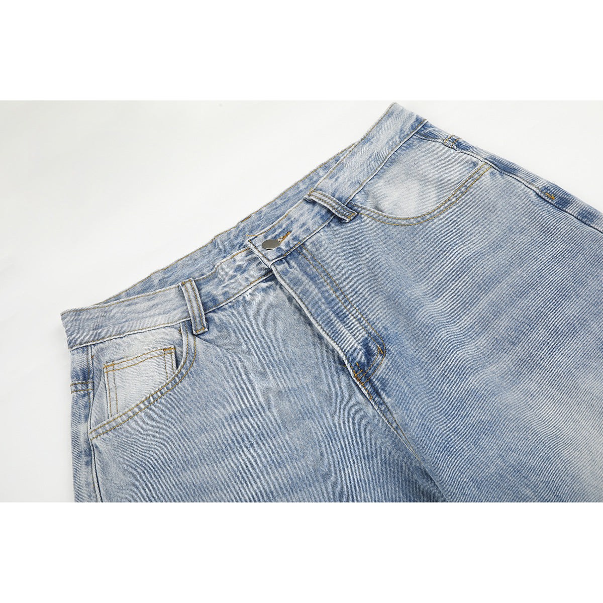 Close-up of light-wash jeans showing the waistband, button, belt loops, fly, and front pockets.