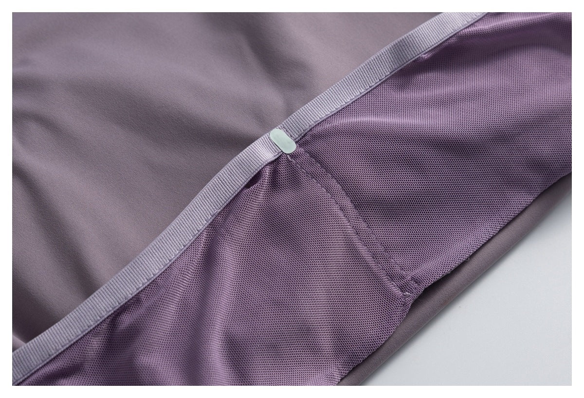Close-up showing the mauve top's mesh panel, stitched seams, and ribbed trim.