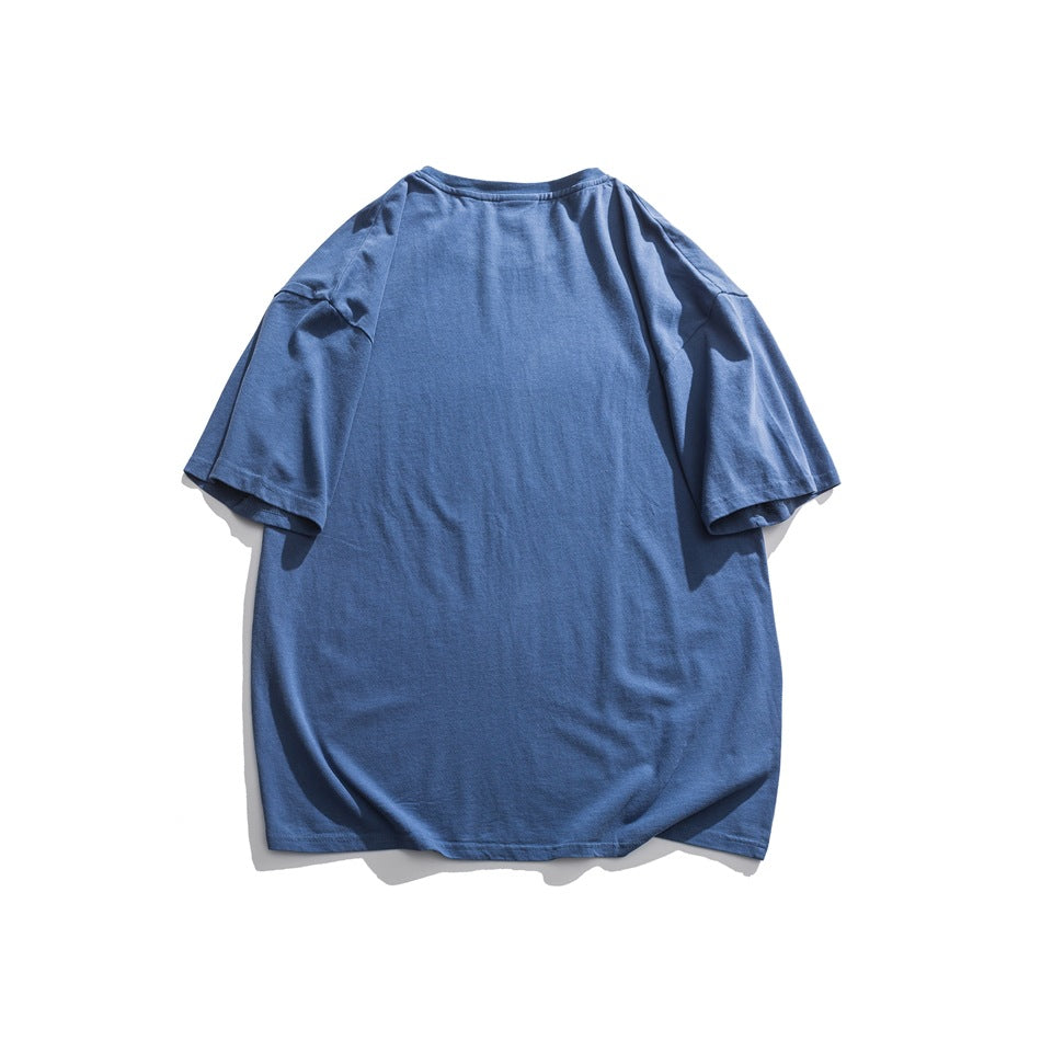 Back view of a plain blue oversized short-sleeve T-shirt laid flat.