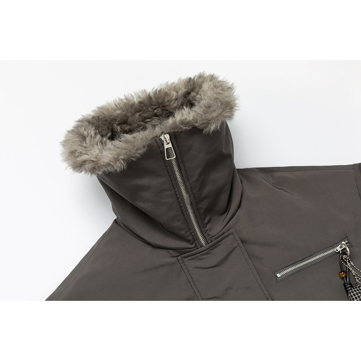 Close-up of the jacket's raised hood, gray fur trim, zipper and chest zip pocket.