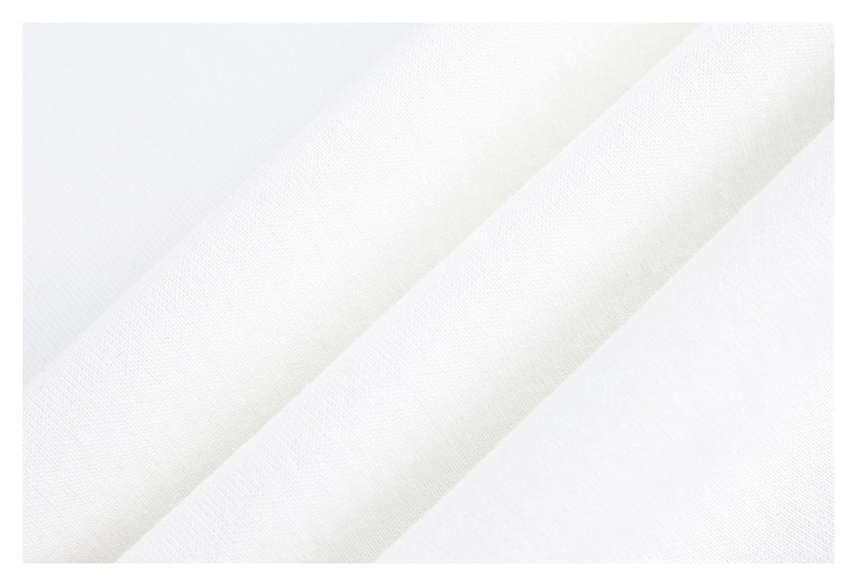 Close-up of plain white fabric with a fine, subtle woven texture.