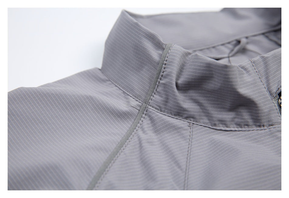 Close-up of the jacket's stand collar, shoulder seam, and fine striped surface.