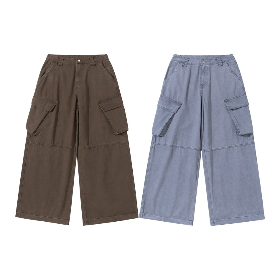 Front views of wide-leg cargo pants in brown and light blue, each with large side flap pockets.