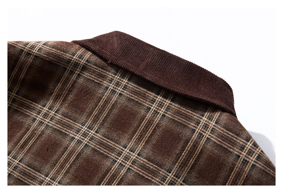 Close-up of the garment's dark brown collar against brown plaid fabric.